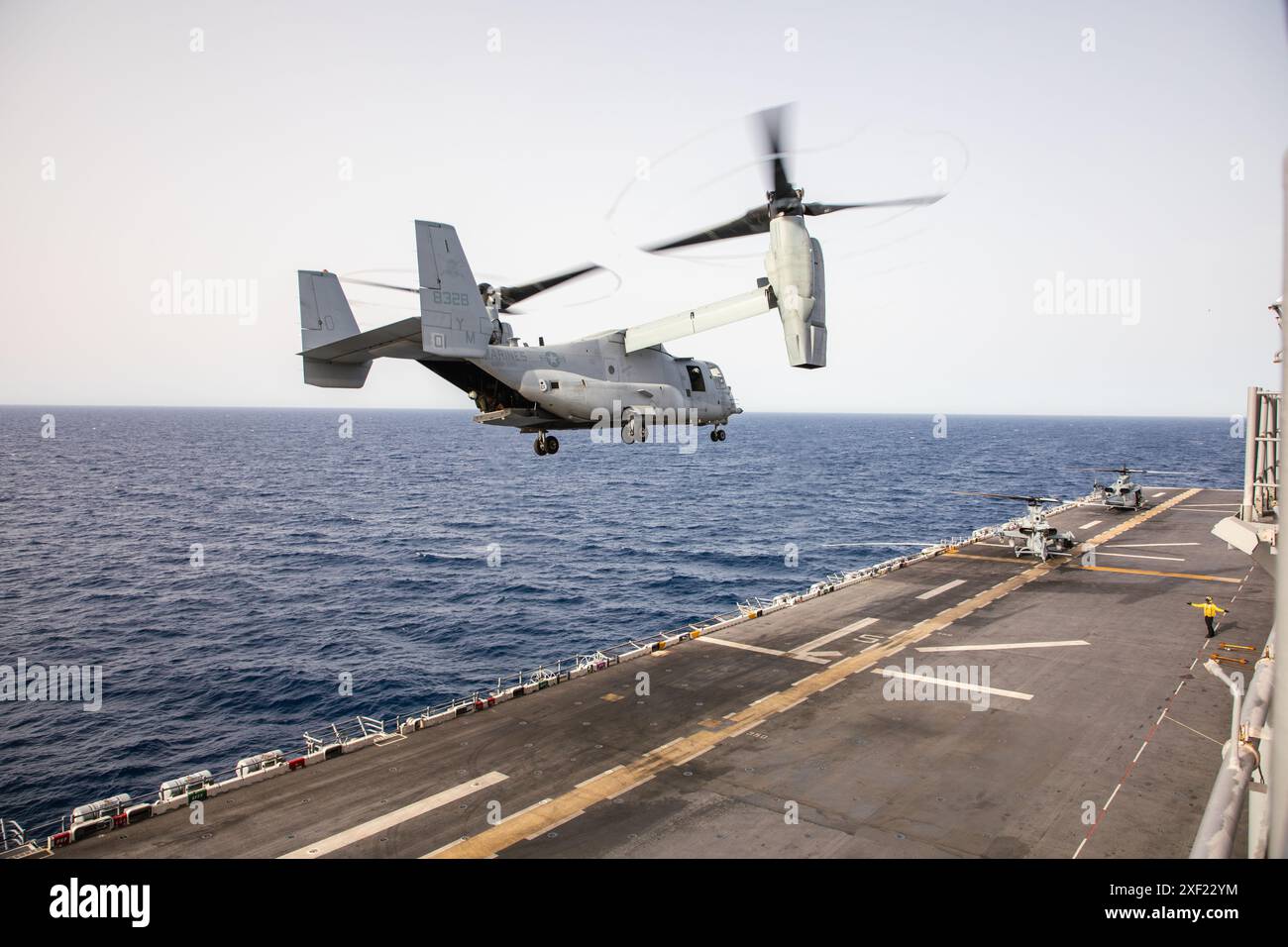 A U.S. Marine Corps MV-22B Osprey tiltrotor aircraft with Marine Medium ...