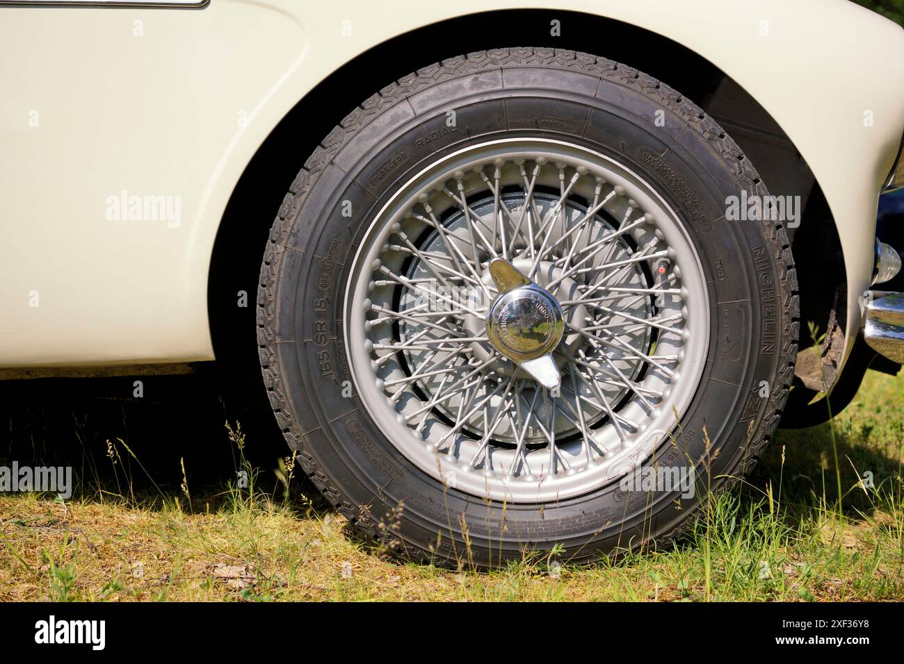 Close-up of a car tire, wire spoke wheel Stock Photo - Alamy