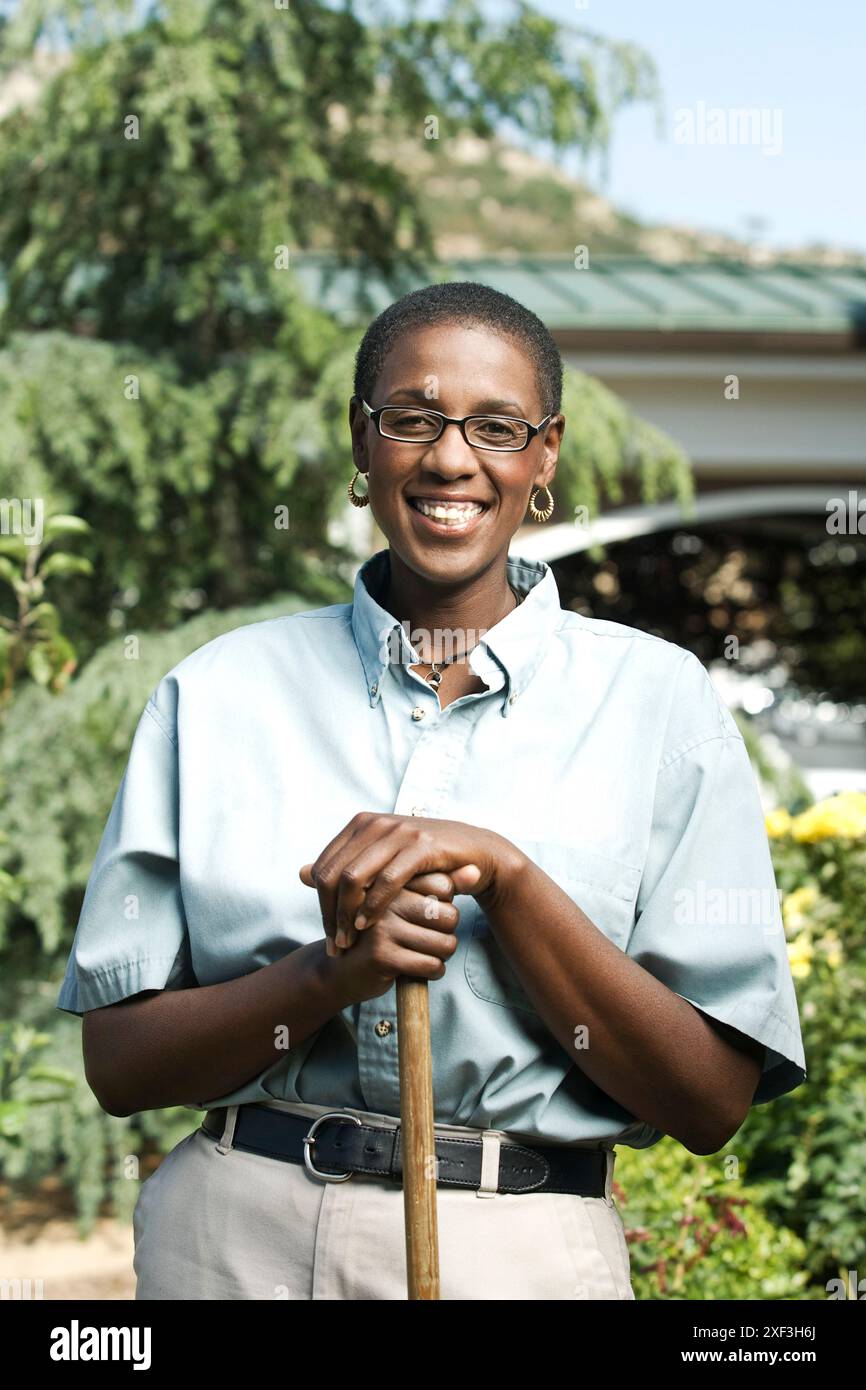 Cheerful african woman in shirt hi-res stock photography and images - Alamy