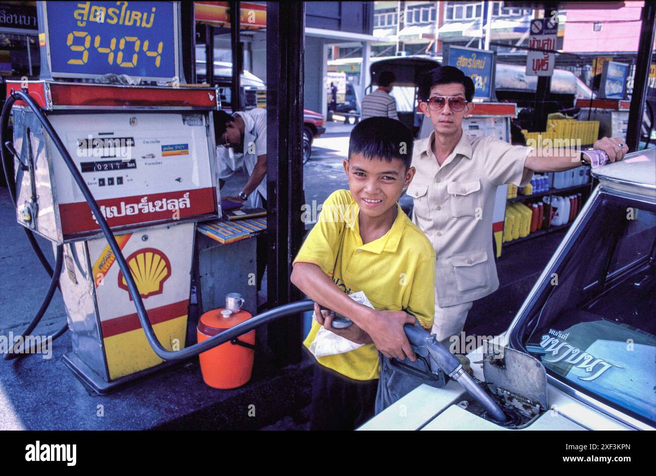 Shell Pump Boy Thailand, Bangkok - boy works at petrol pump Stock Photo - Alamy