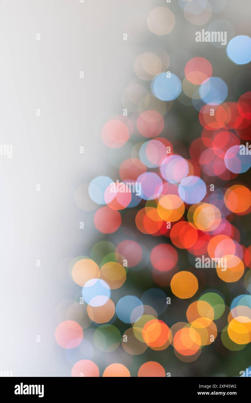 Christmas tree illuminated with garlands of lights, defocused image, bokeh Stock Photo