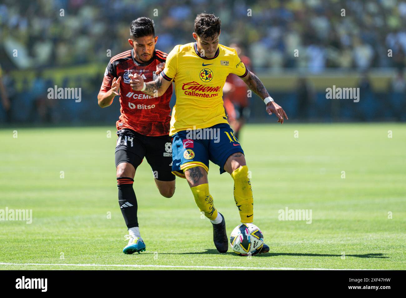 América defender Cristian Calderón (18) is defended by Tigres UANL midfielder Jesús Garza (14) during the 2024 Campeón de Campeones match, Sunday, Jun Stock Photo