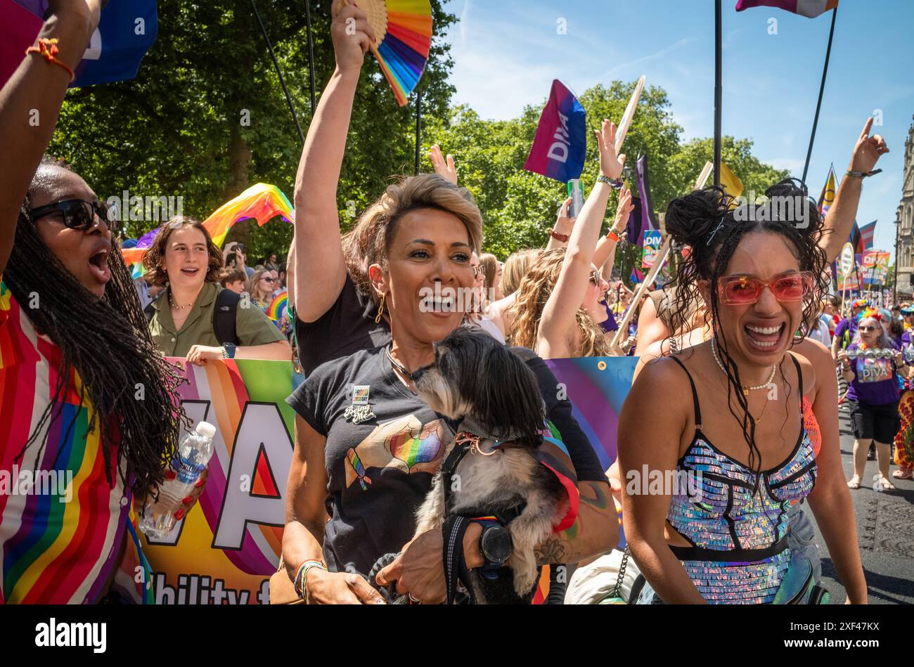 London / UK - Jun 29 2024: Lesbians and a dog party at the annual Pride in London parade. The celebration brings together people from LGBTQ+ communiti Stock Photo