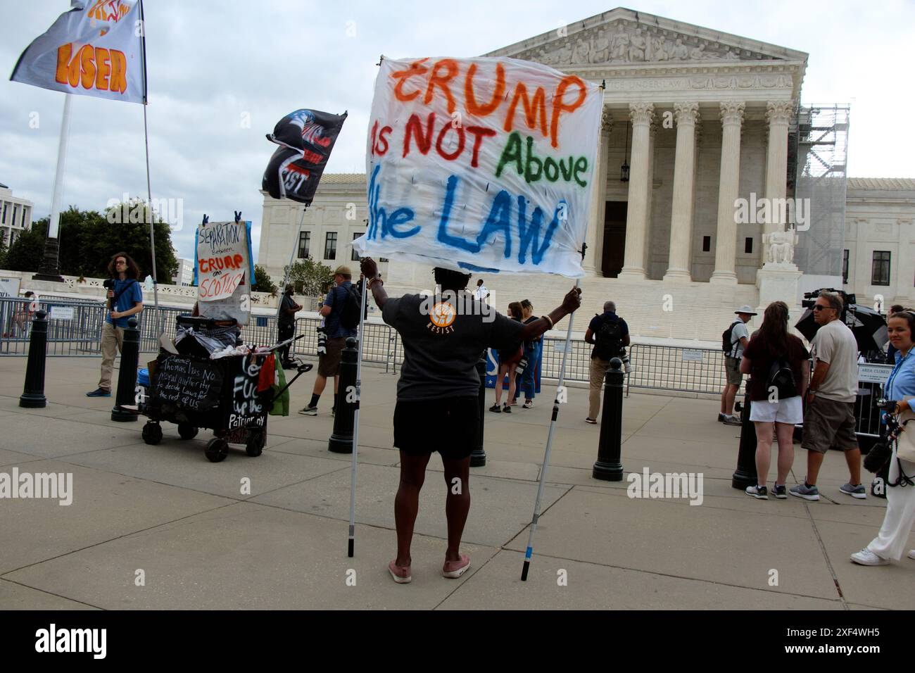 July 1, 2024, Washington, District Of Columbia, U.S: The Supreme Court Building seen the morning of the anticipated release of opinions in Corner Post, Inc. v. Board of Governors of the Federal Reserve System, Moody v. NetChoice, LLC, NetChoice, LLC v. Paxton, and Trump v. United States with an person holding a sign that reads, ''trump is NOT Above the LAW'' on it. (Credit Image: © Evan Golub/ZUMA Press Wire) EDITORIAL USAGE ONLY! Not for Commercial USAGE! Stock Photo