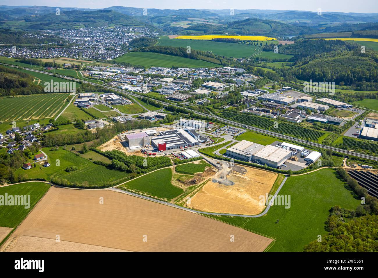 Aerial view, Enste industrial estate with citizen solar park photovoltaic solar power plant, on the A46 highway, ITH Schraubtechnik | ITH Bolting Tech Stock Photo