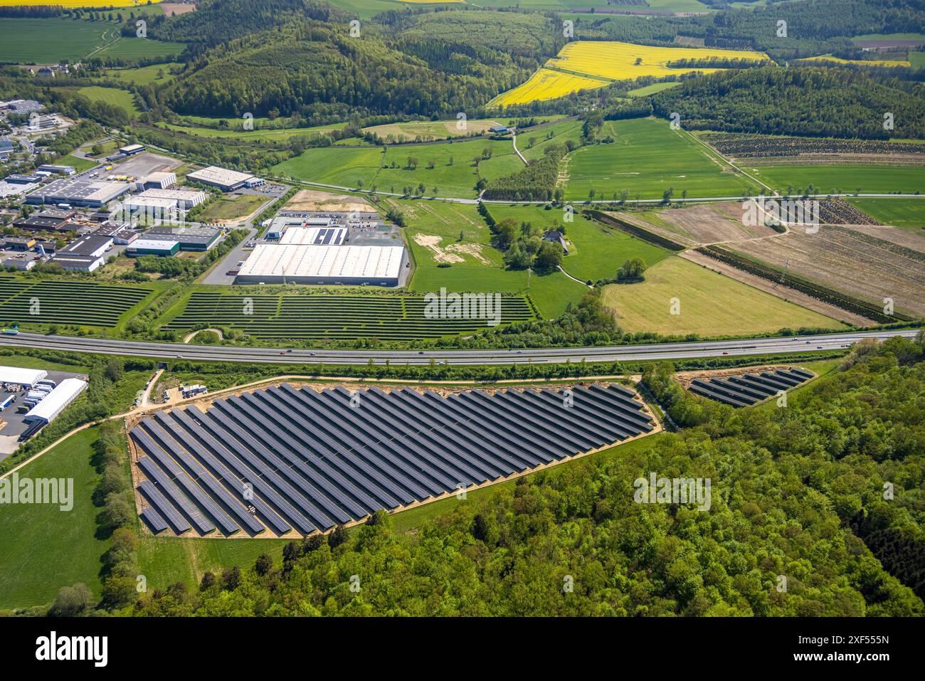 Aerial view, Enste industrial estate with citizen solar park photovoltaic solar power plant, on the A46 highway, Briloner Leuchten GmbH, Enste, Mesche Stock Photo