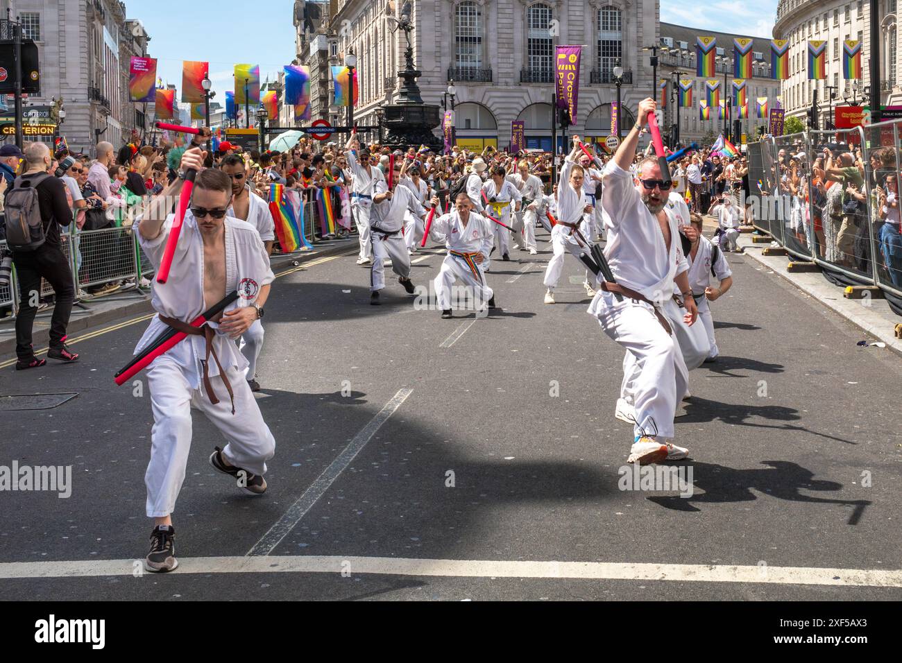 London / UK - Jun 29 2024: Gay men demonstrate martial arts at the annual Pride in London parade. The celebration brings together people from LGBTQ+ c Stock Photo