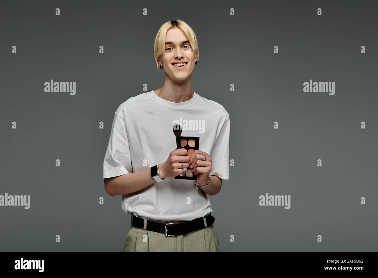 Smiling artist holding palette hi-res stock photography and images - Alamy
