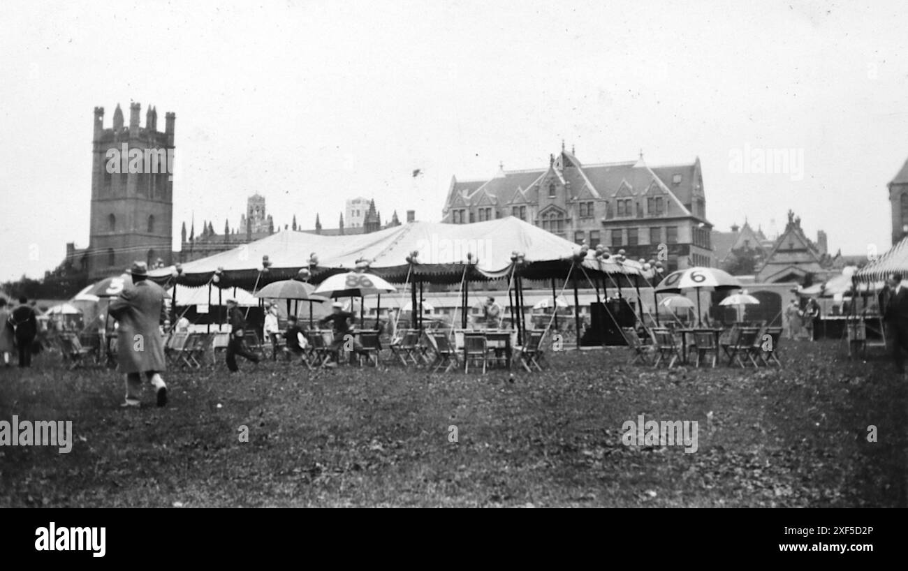 Social history: A large tent and parasols on a grass area, Chicago, mid 1920s. From a photograph album c1920s, original images were of various sizes. A note with the album stated: “This album was sent to England by the Executors of Helen Friese whose mother was an Elster sister of Augustus Karl. The family emigrated to Chicago from Triev, Germany. Helen was a teacher and an only child. Karl Friese and his brother married two Elster sisters, Dina and Leise.” Family images and images of Chicago, many were snapshots. These were amateur photographs. Stock Photo