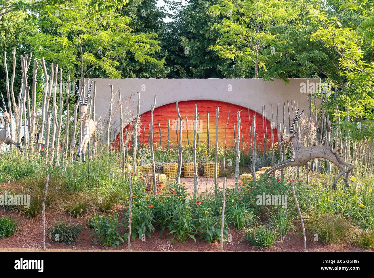 East Molesey, UK. 1st July, 2024. The Lion King Anniversary Garden by Juliet Sargeant, an ode to the 25th anniversary of Disney’s West End musical which aims to “rethink the English garden” with climate change in mind, has won the top award on the opening day of the RHS Hampton Court Palace Garden Festival 2024. Inspired by the stage production and offering visitors a space to sit and reflect on their own journey through the ‘Circle of Life’ at the centre of a community garden, judges awarded Sergeant with Best Show Garden. The garden also won the Environmental Innovation Award at the RHS Hamp Stock Photo