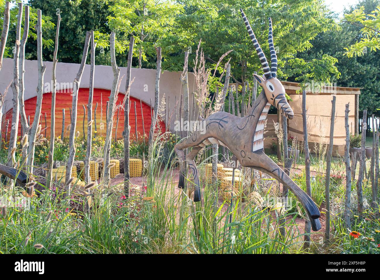 East Molesey, UK. 1st July, 2024. The Lion King Anniversary Garden by Juliet Sargeant, an ode to the 25th anniversary of Disney’s West End musical which aims to “rethink the English garden” with climate change in mind, has won the top award on the opening day of the RHS Hampton Court Palace Garden Festival 2024. Inspired by the stage production and offering visitors a space to sit and reflect on their own journey through the ‘Circle of Life’ at the centre of a community garden, judges awarded Sergeant with Best Show Garden. The garden also won the Environmental Innovation Award at the RHS Hamp Stock Photo