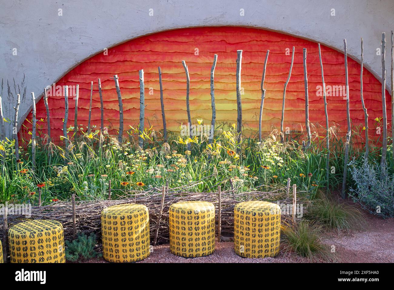 East Molesey, UK. 1st July, 2024. The Lion King Anniversary Garden by Juliet Sargeant, an ode to the 25th anniversary of Disney’s West End musical which aims to “rethink the English garden” with climate change in mind, has won the top award on the opening day of the RHS Hampton Court Palace Garden Festival 2024. Inspired by the stage production and offering visitors a space to sit and reflect on their own journey through the ‘Circle of Life’ at the centre of a community garden, judges awarded Sergeant with Best Show Garden. The garden also won the Environmental Innovation Award at the RHS Hamp Stock Photo