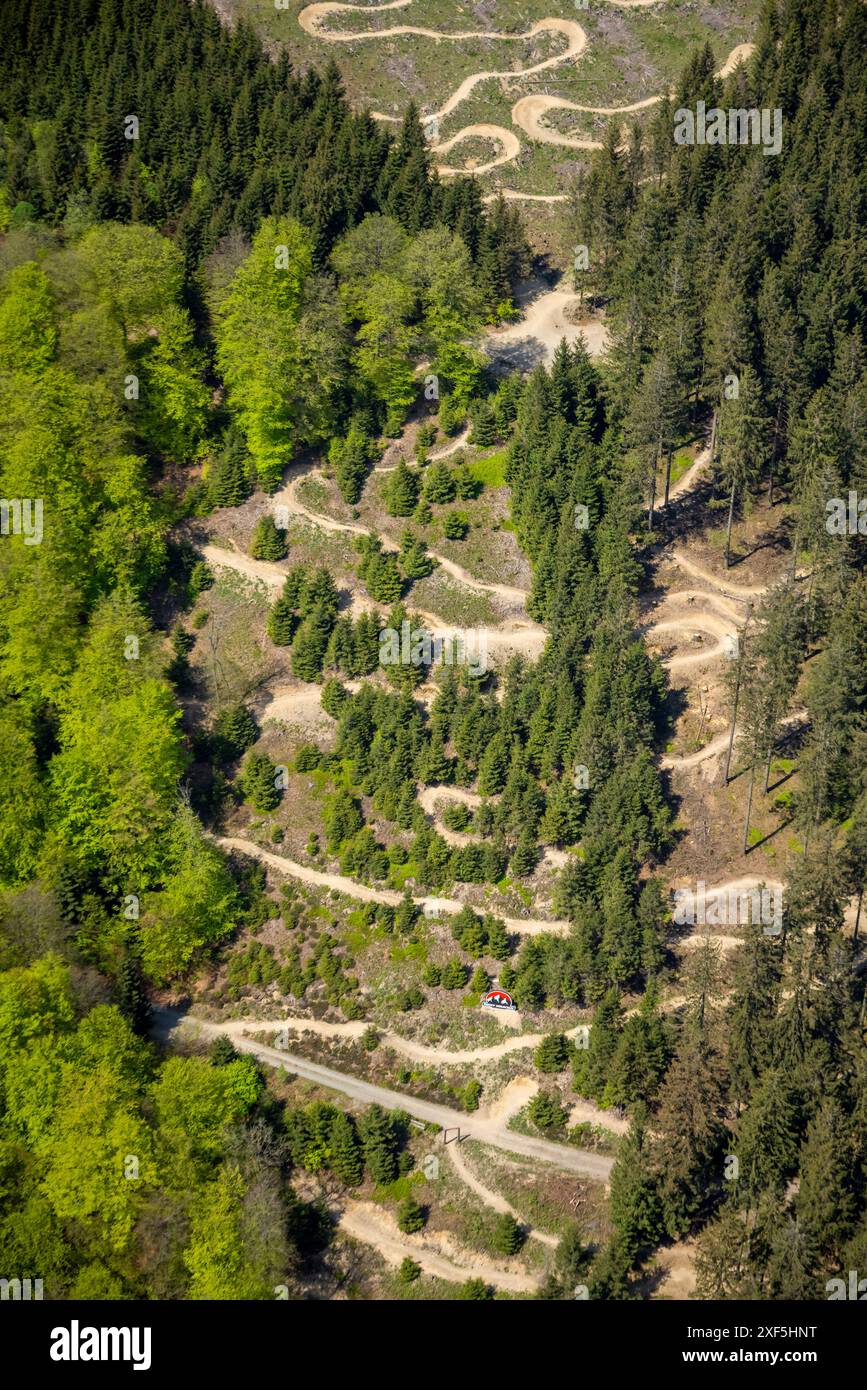 Aerial view, Green Hill Bikepark, mountain bike trail in the Gellinghausen district, serpentine downhill terrain, surrounded by forest, meadows and fi Stock Photo