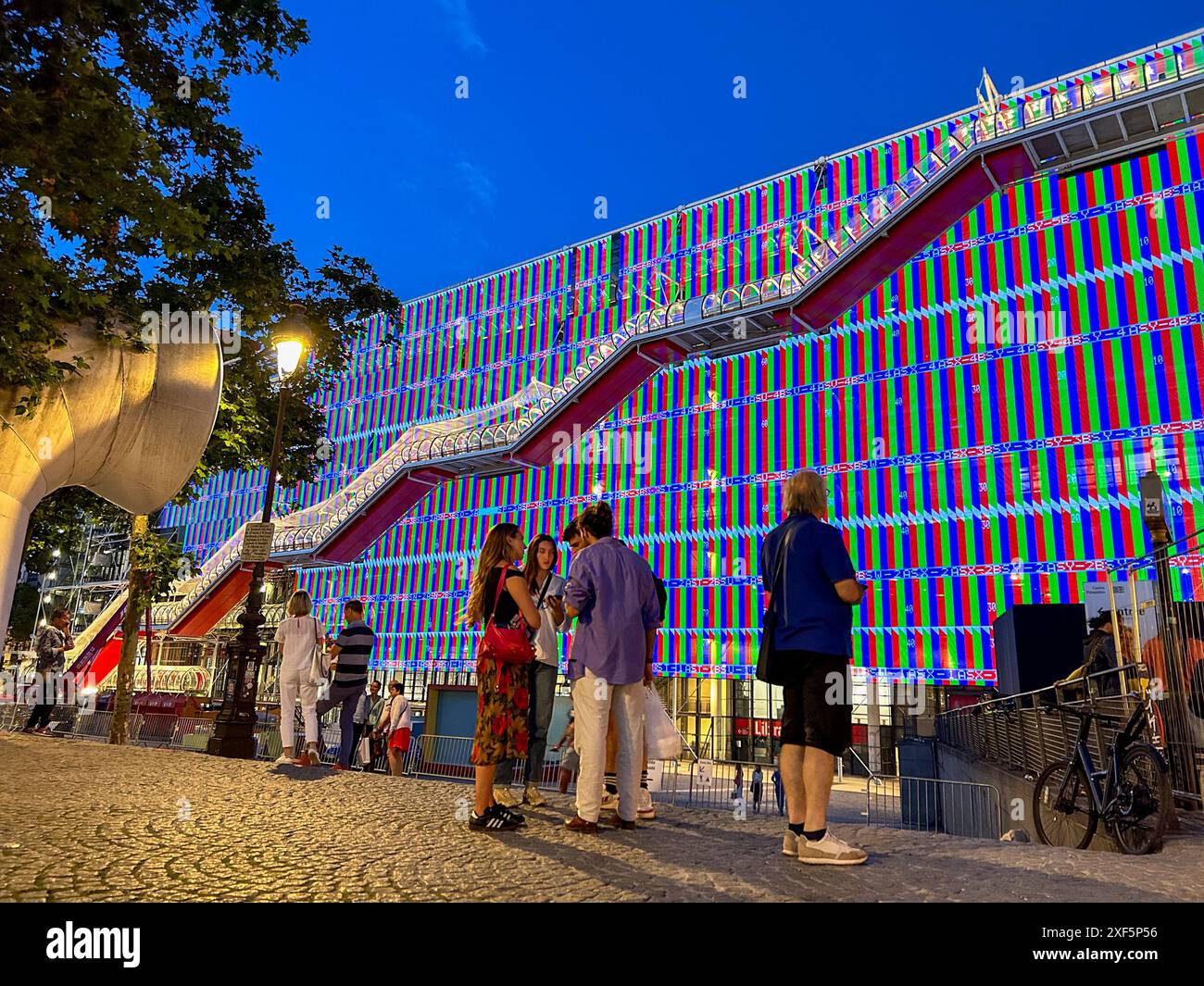 Paris, France, Groups of People, in front of George Pompidou Center, Museum of Modern Art with Special LED Lighting Effects on Facade, Night Stock Photo