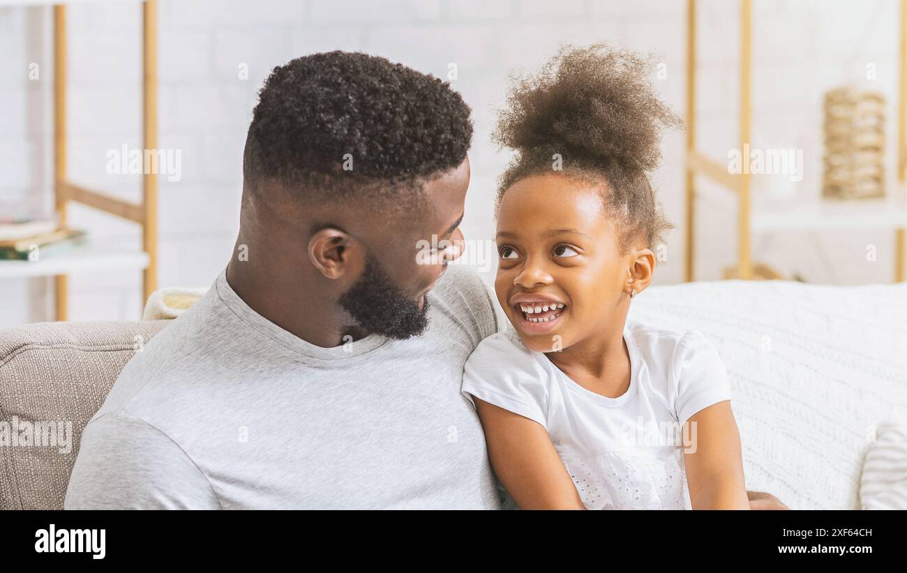 Happy Black Father and Daughter Laughing Together On Couch Stock Photo ...
