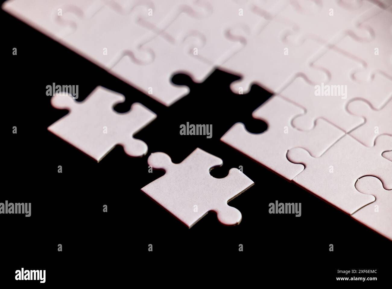 A puzzle piece is missing from a puzzle. Concept of loss and emptiness ...