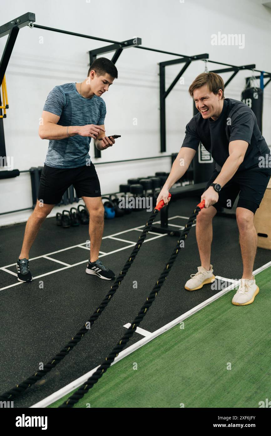 Man athlete waving ropes crossfit hi-res stock photography and images ...