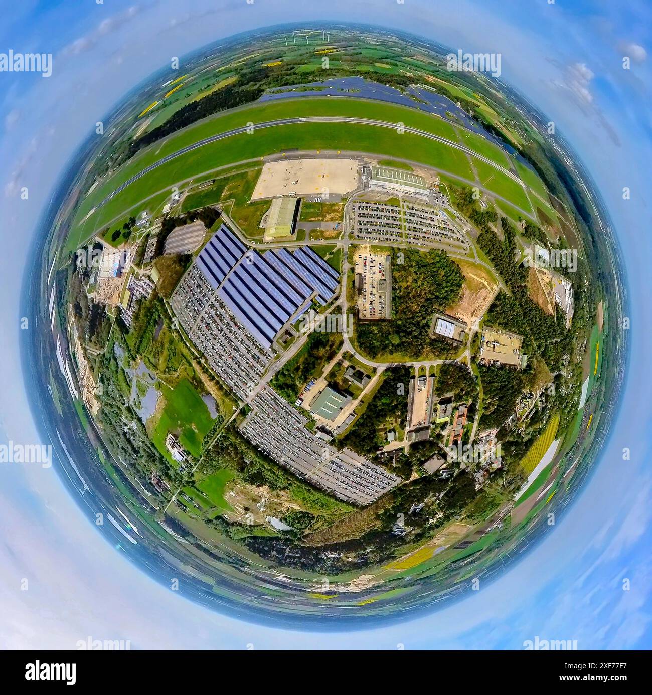 Aerial view, Airport Weeze, runway and landing strip, Ryanair airline, solar park and terminal check-in hall, parking lots, meadows and fields, globe, Stock Photo