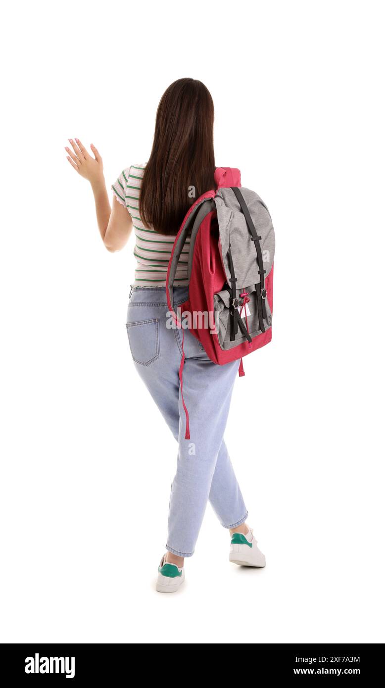 Female student with backpack on white background, back view Stock Photo