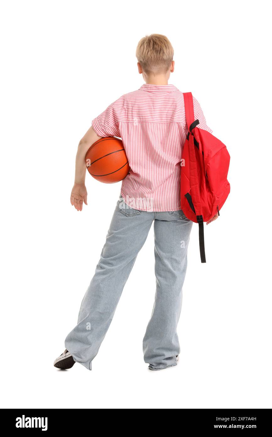 Female student with backpack and ball on white background, back view Stock Photo