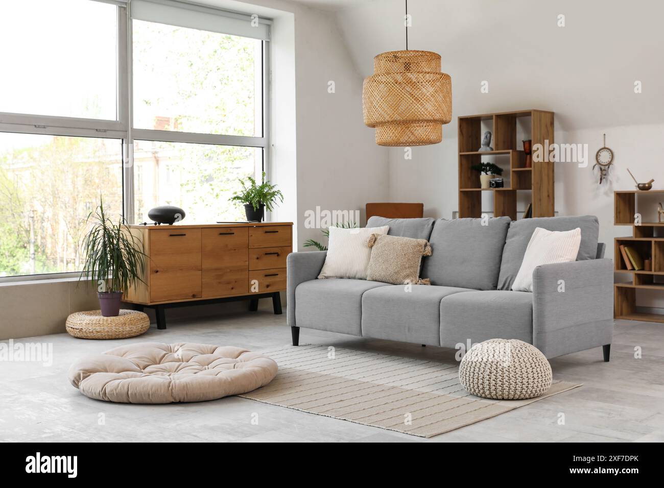 Interior of living room with sofa and glucophone on drawers Stock Photo