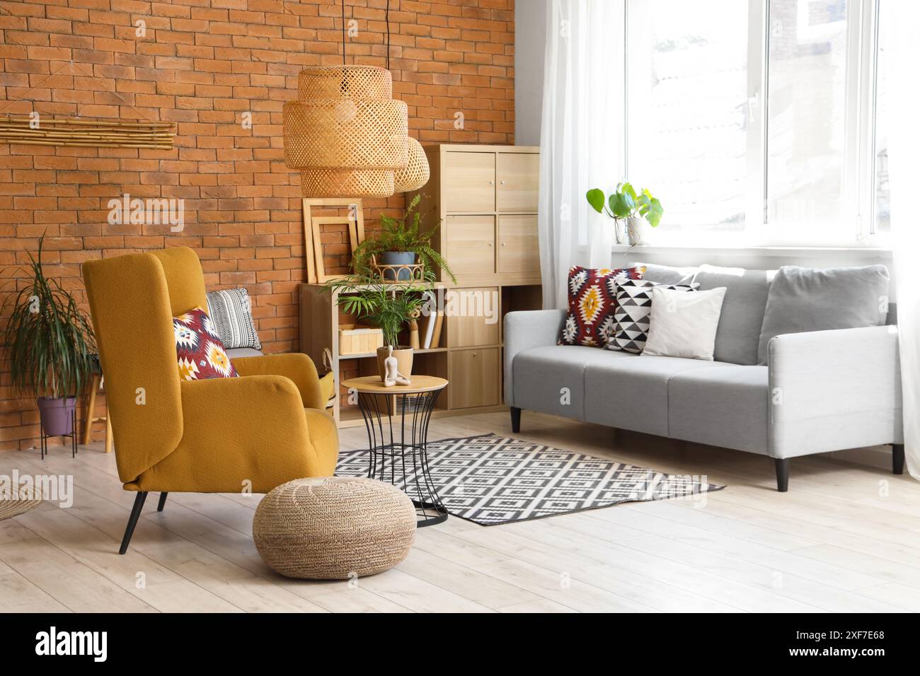 Armchair and sofa in interior of living room Stock Photo - Alamy