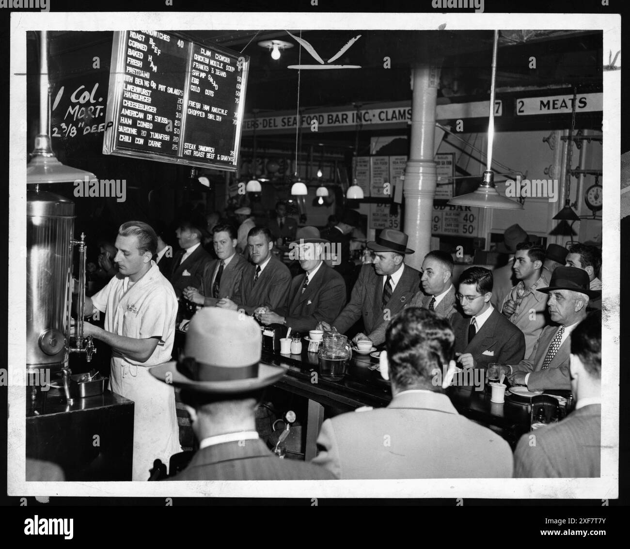 Lunchtime crowd made up mostly of men eat lunch at Pete's Bar in