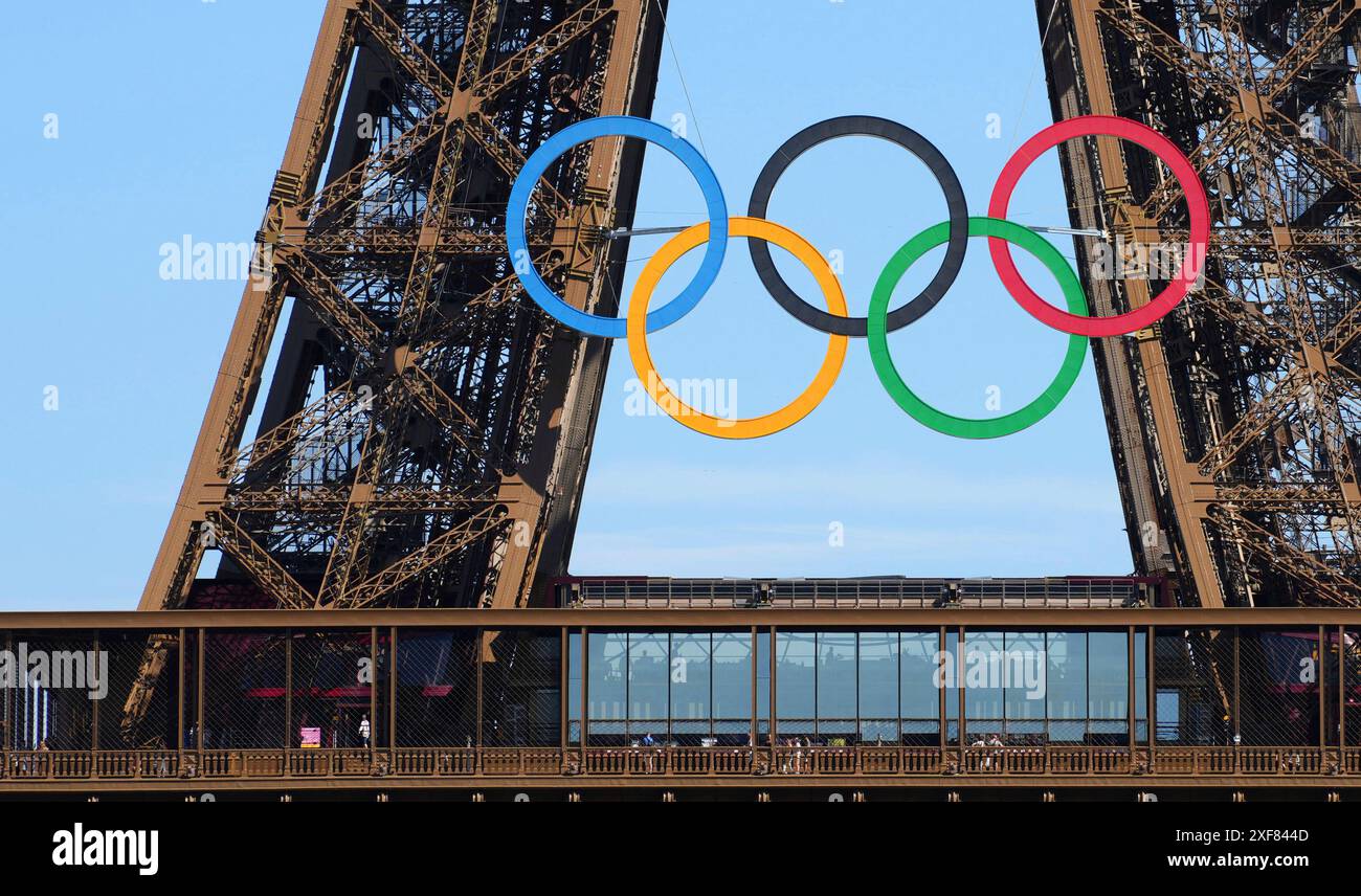 The Olympic five rings mounted on the Eiffel Tower is seen in Paris ...