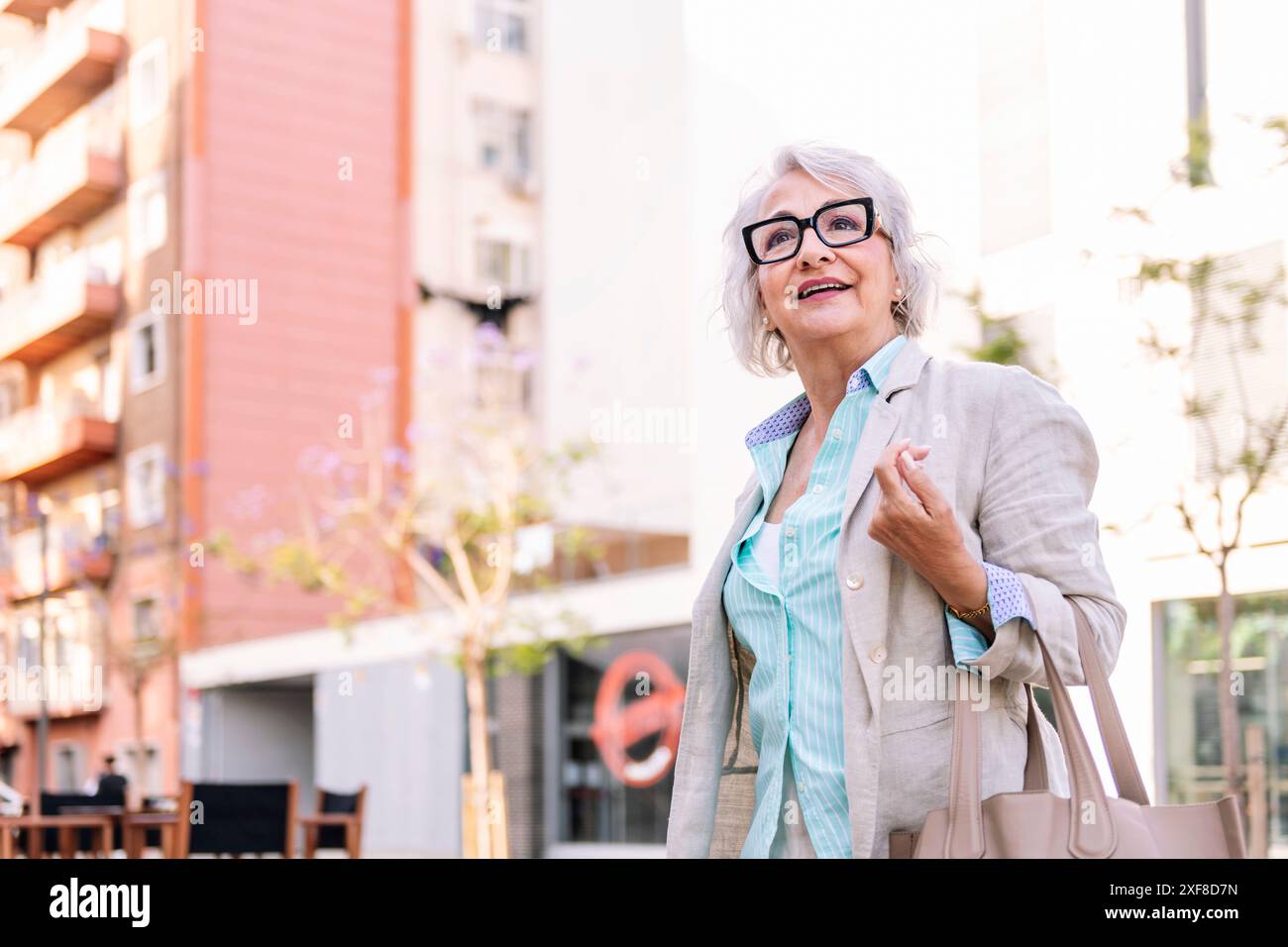 Woman walking arm hi-res stock photography and images - Alamy