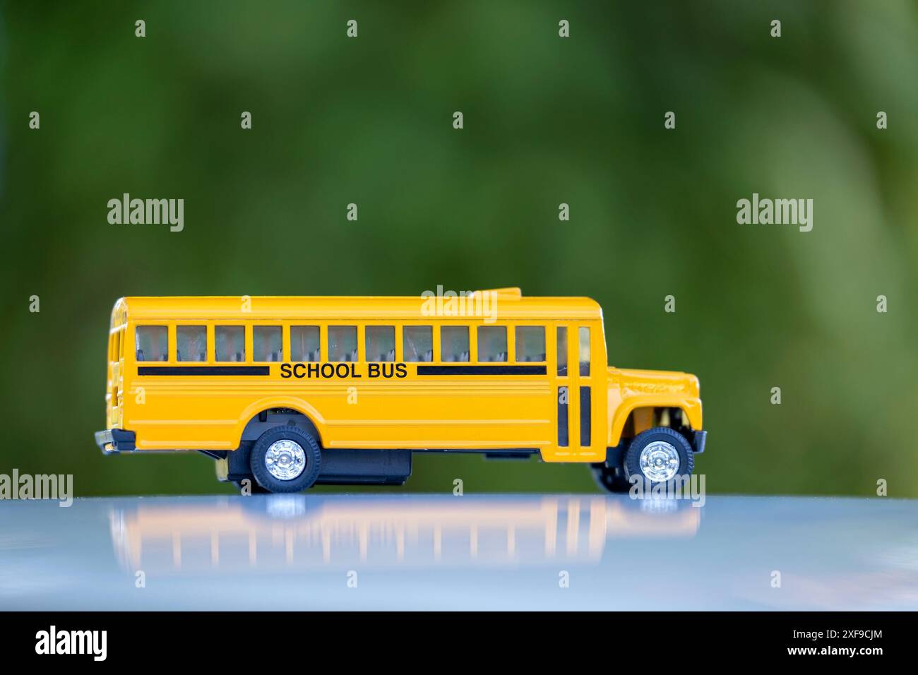 Model of classical american yellow school bus for transporting of kids ...