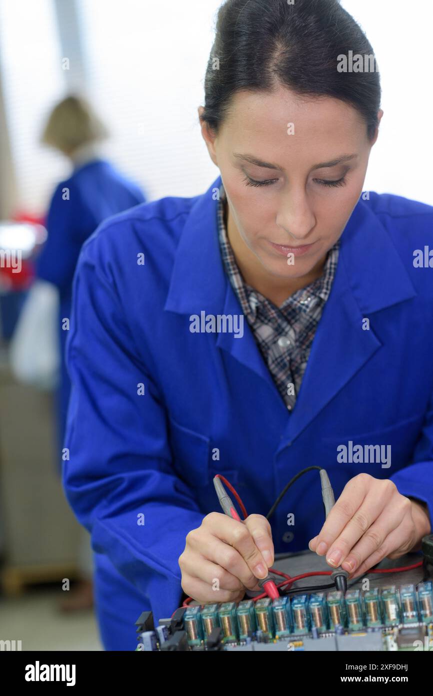 portrait of woman in robotics lab Stock Photo