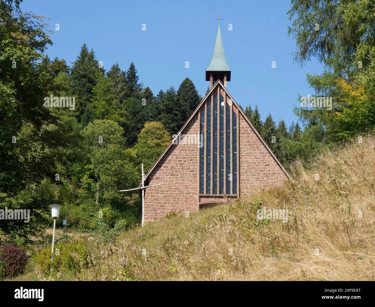 A small wooden church on a hill, surrounded by forest and nature, freudenstadt, black forest, germany Stock Photo