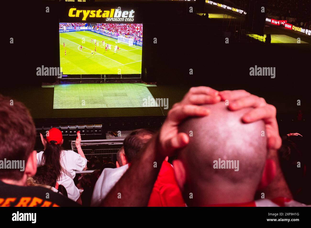 Tbilisi, Georgia - 20th june, 2024: Georgia - Spain football match. Male spectator watch football match express emotions, bet on loosing team. Lost be Stock Photo
