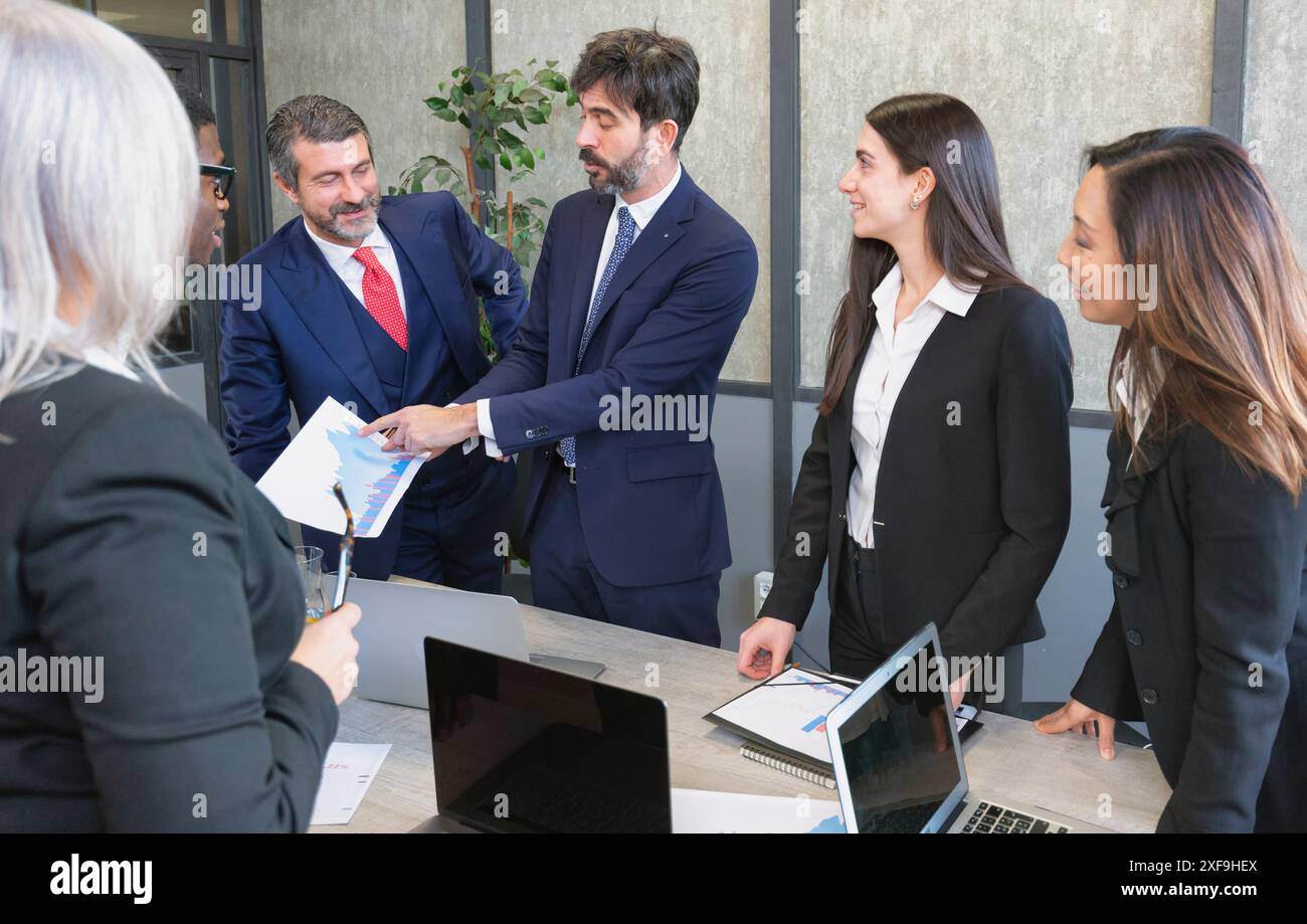 Business people group meeting .Profession businesswomen, businessmen and office workers working in team conference with project planning document on m Stock Photo