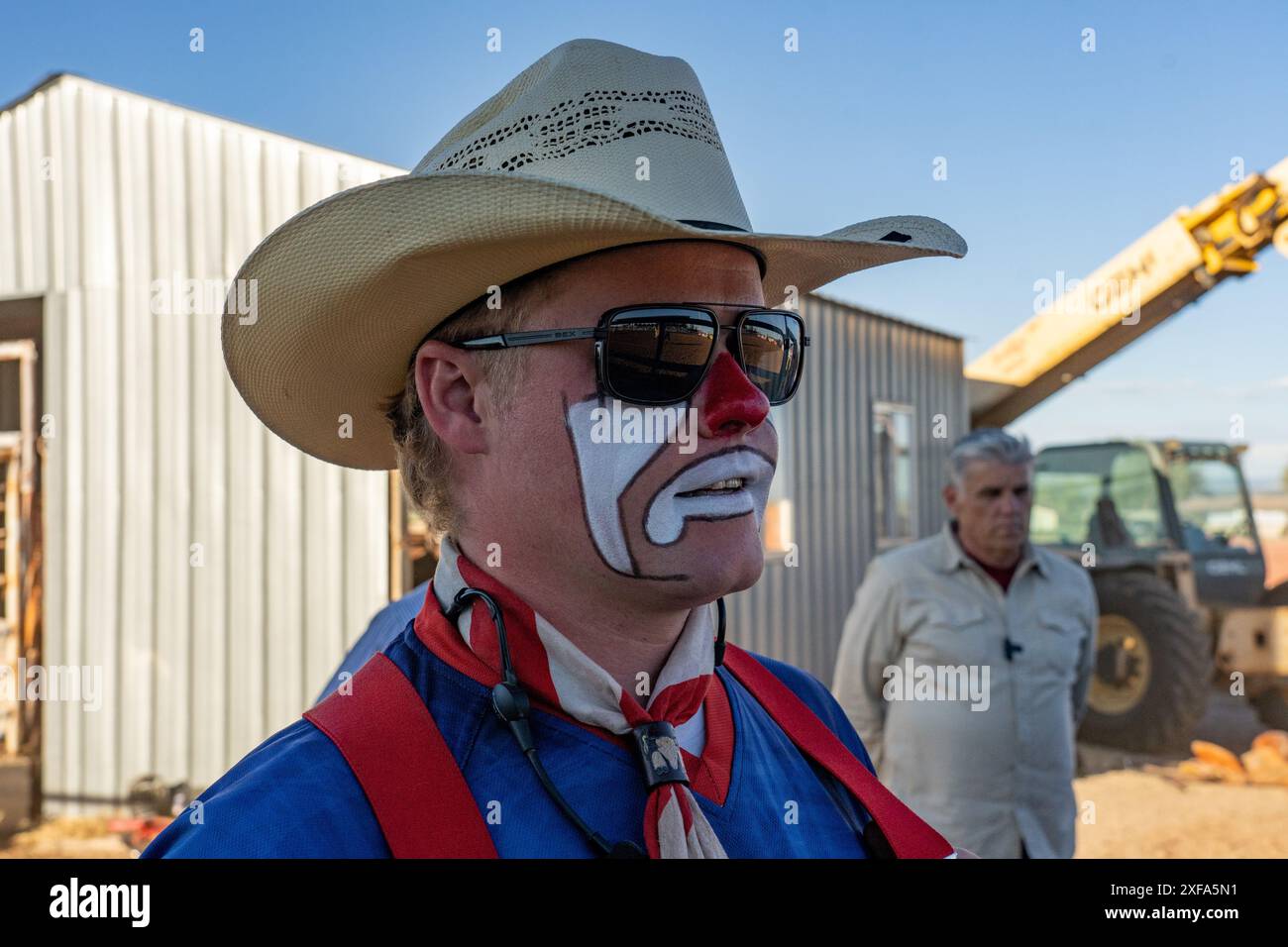 A PRCA rodeo clown / bull fighter in his face paint and costume at a rodeo in rural Utah. Stock Photo