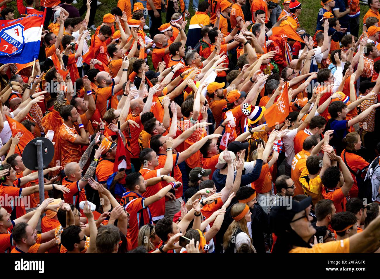 MUNICH - Dutch fans walk behind the Oranjebus during the fan walk to ...