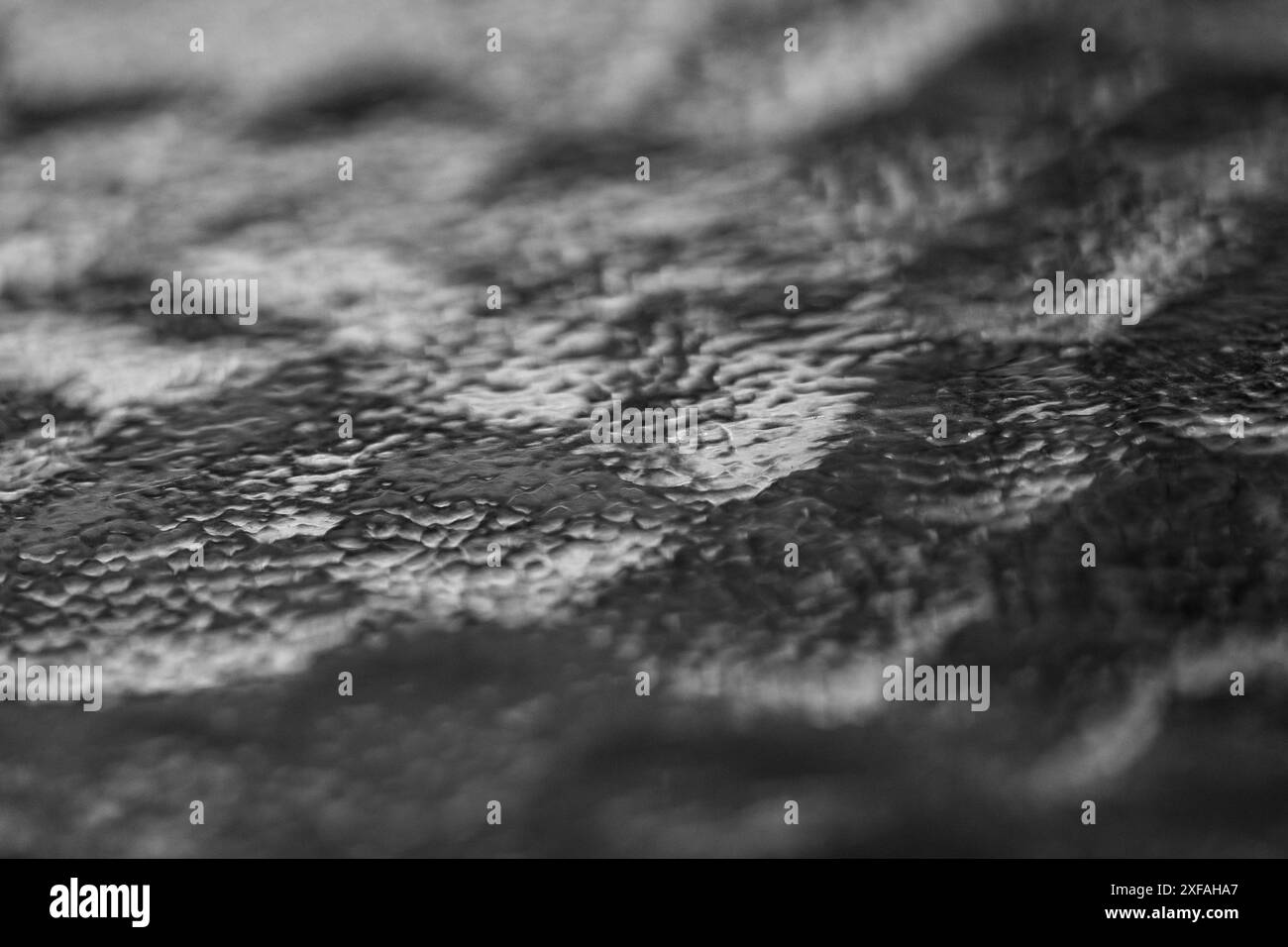 Abstract Lake. Glass Waves on Table in Macro Perspective. Black and white. Monochrome. Stock Photo