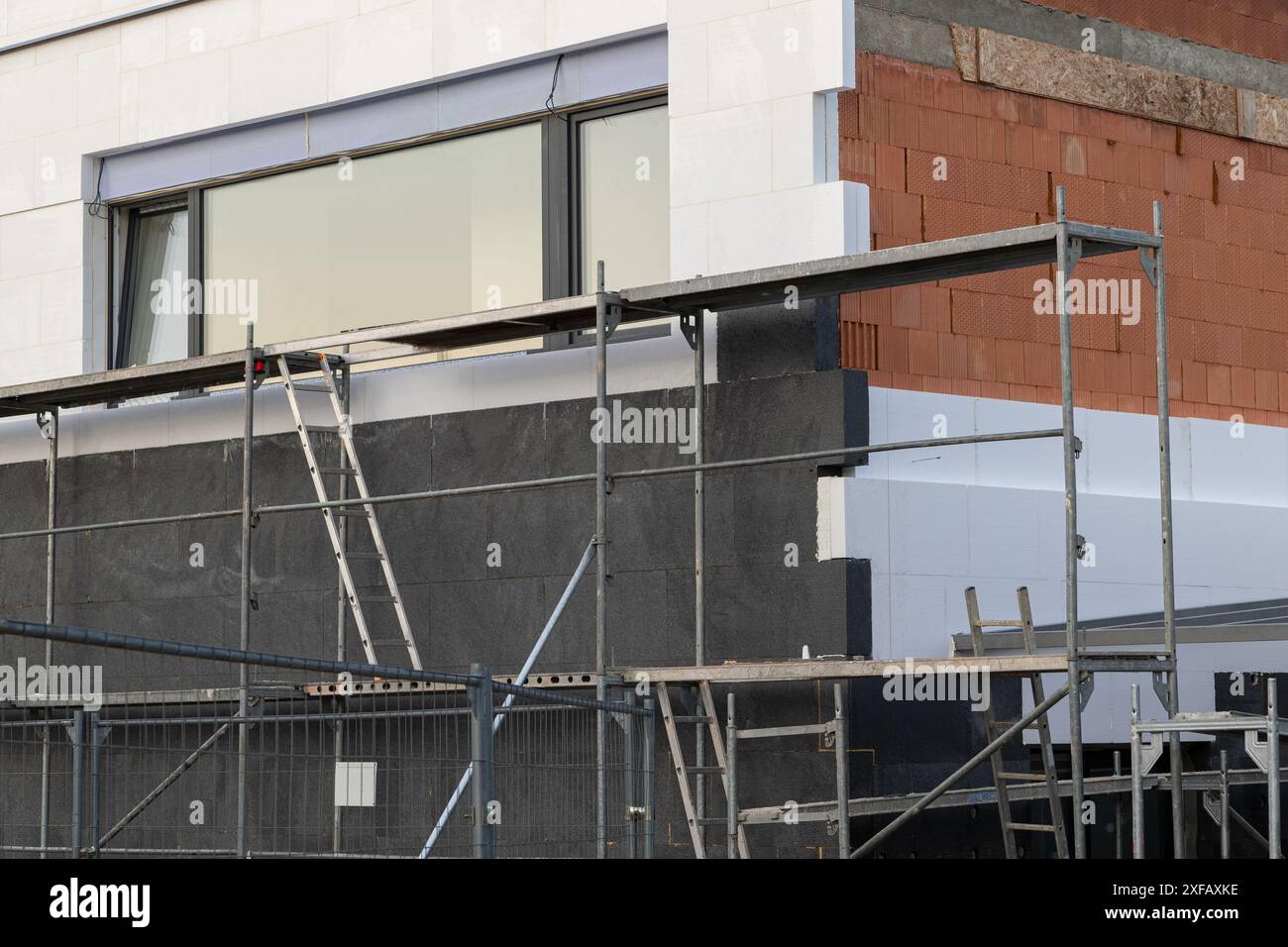 Image showcasing insulating the walls with modern thermal insulation materials. The new ...