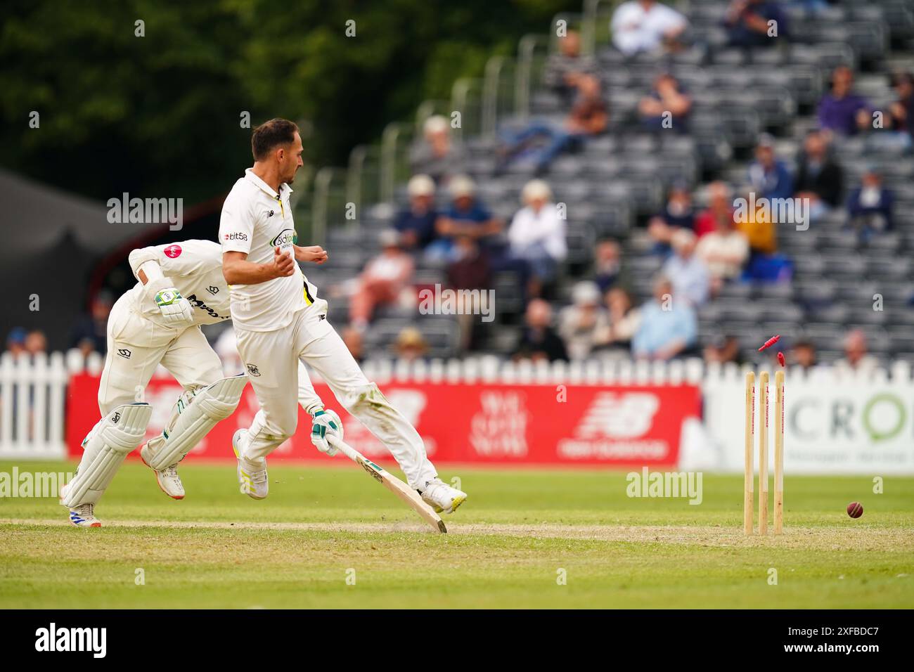 Cheltenham, UK, 2 July 2024. Gloucestershire's Zaman Akhter attempts to run out Glamorgan's Eddie Byrom by kicking the ball at the stumps during the Vitality County Championship Division Two match between Gloucestershire and Glamorgan. Credit: Robbie Stephenson/Gloucestershire Cricket/Alamy Live News Stock Photo