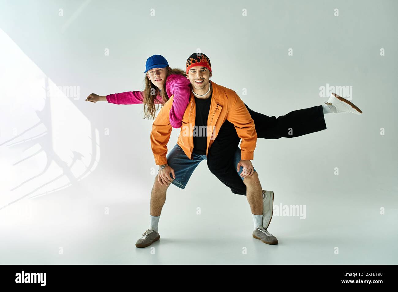 two men strike a stylish pose for a picture together Stock Photo - Alamy