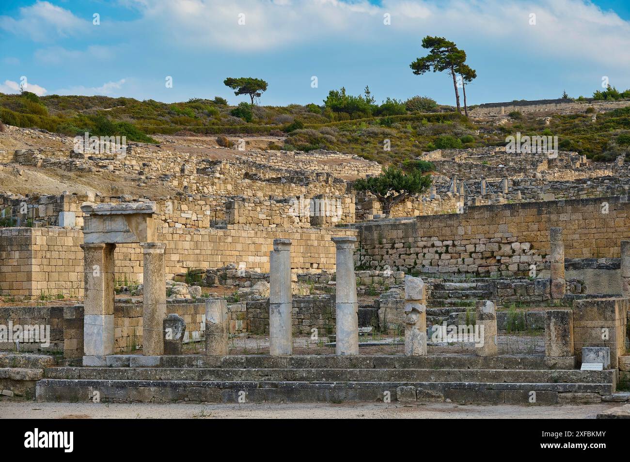 Ancient temple with half-ruined columns and stone structures in a ...
