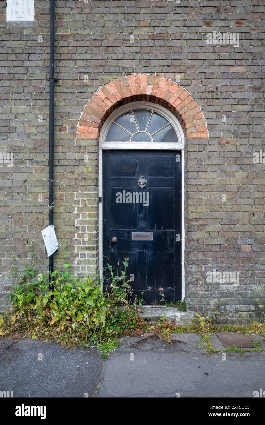 Black door with curved window above. Dorchester, UK Stock Photo Alamy
