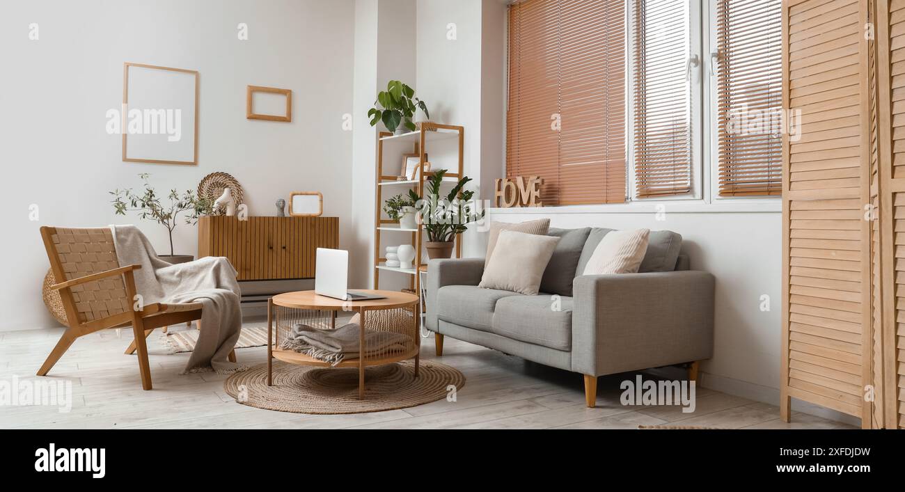 Interior of modern living room with grey sofa, armchair and table Stock ...