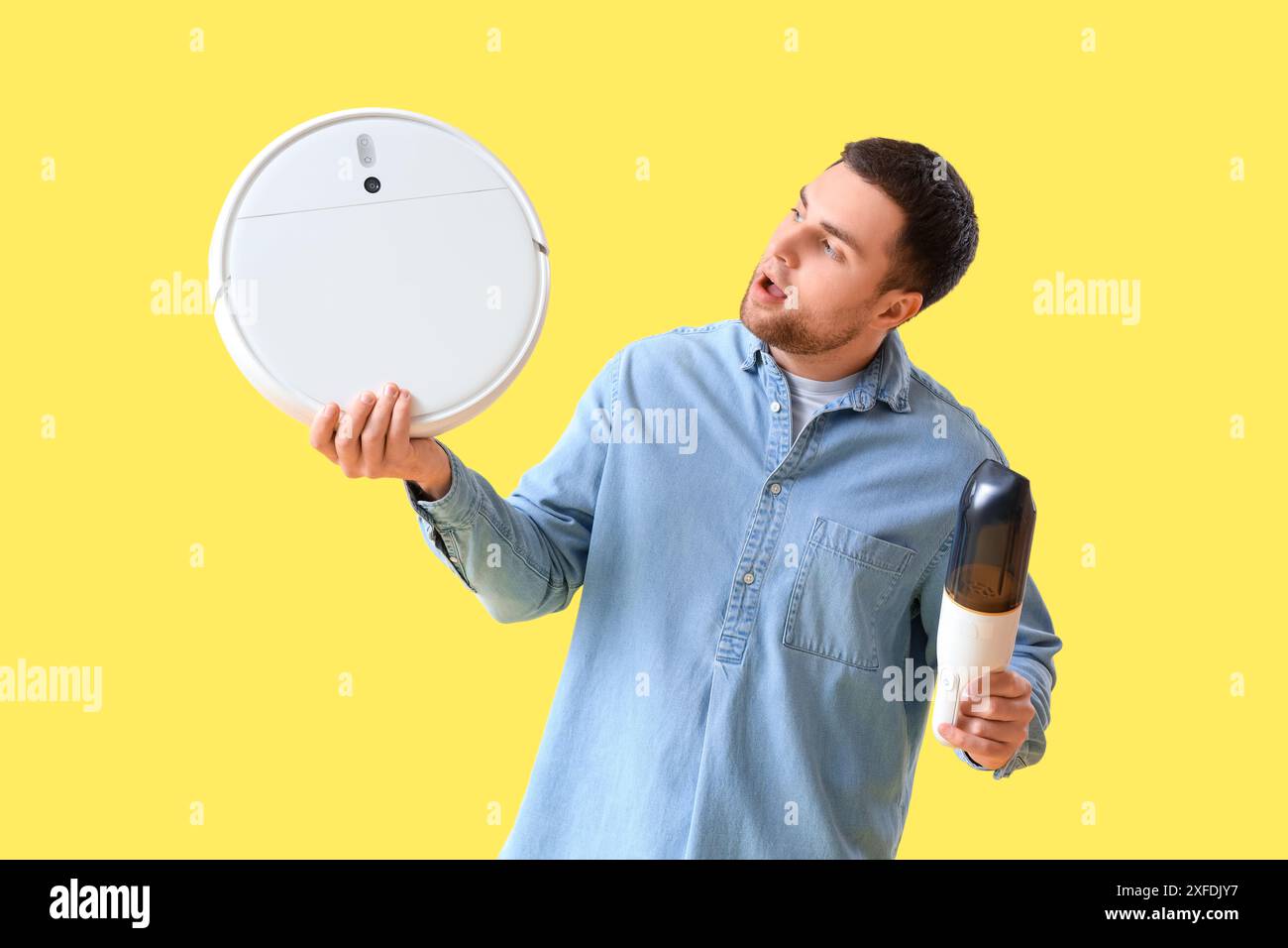 Shocked young man vacuum hi-res stock photography and images - Alamy