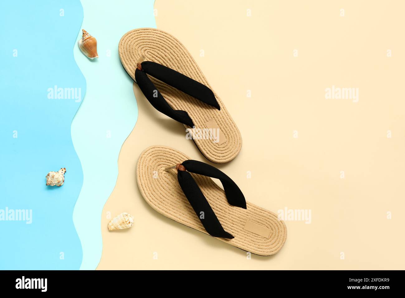 Flip flops with seashells on colorful background Stock Photo