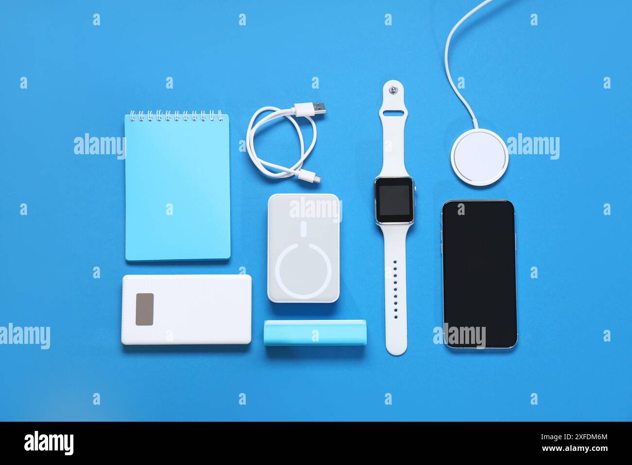 Composition with different modern gadgets and notebook on color background Stock Photo