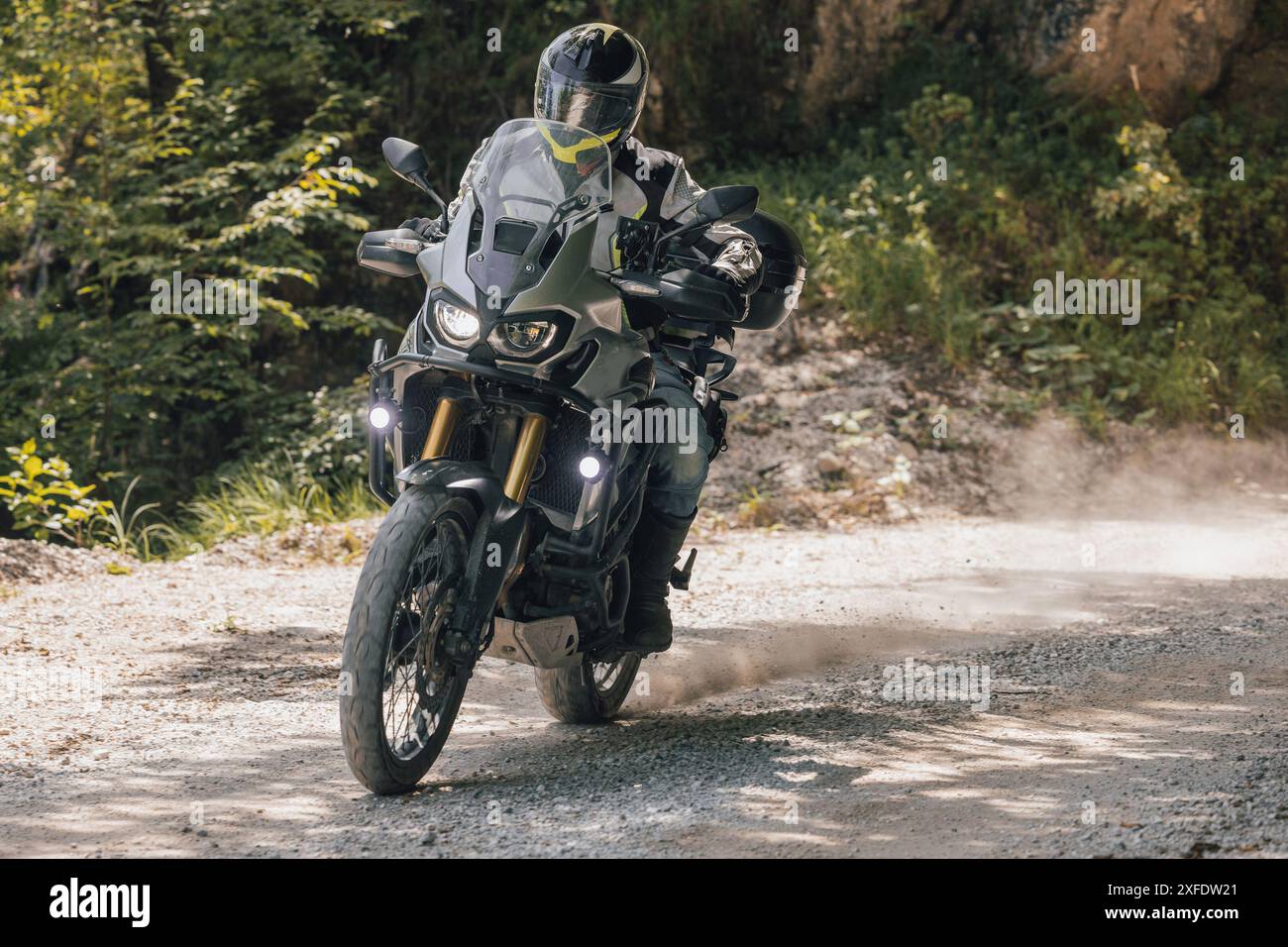 Modern adventure motorcycle on a ride on gravel surface. Motorcycling ...