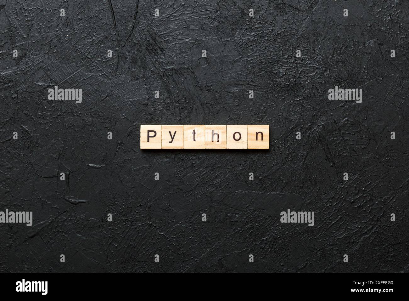 python word written on wood block. python text on table, concept Stock ...
