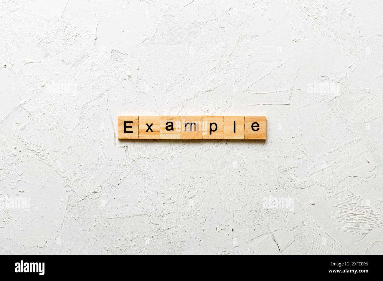 example word written on wood block. example text on table, concept. Stock Photo