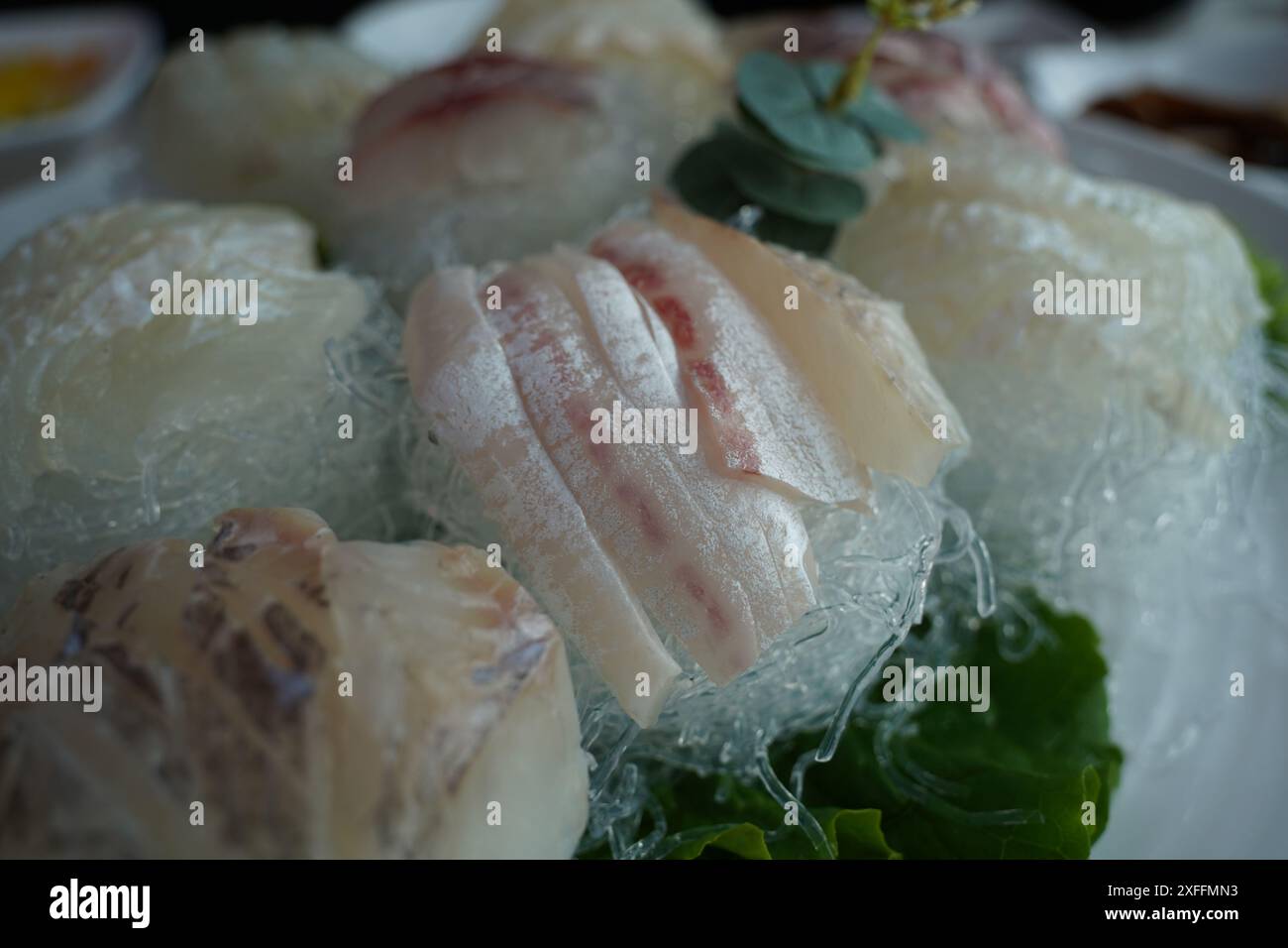 A table of fresh raw fish is served Stock Photo